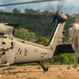 Australian Army soldiers prepare to embark an Australian Army UH-60M Black Hawk.
