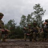 Australian Army soldiers conduct a debrief with an instructor from the Armed Forces of Ukraine after an urban clearance.