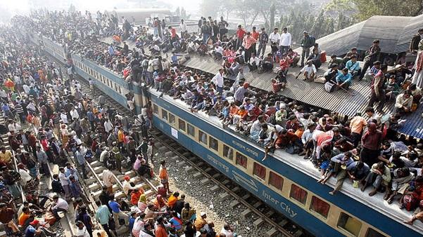 People crowding a train and train platform