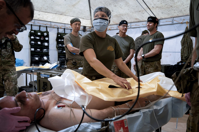 Nursing officer treating a patient